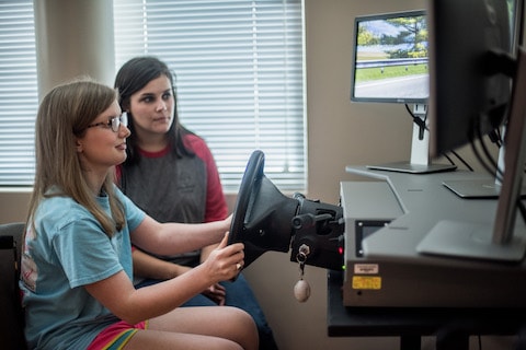 Shepherd patient, Amelia Holley, using assistive technology.