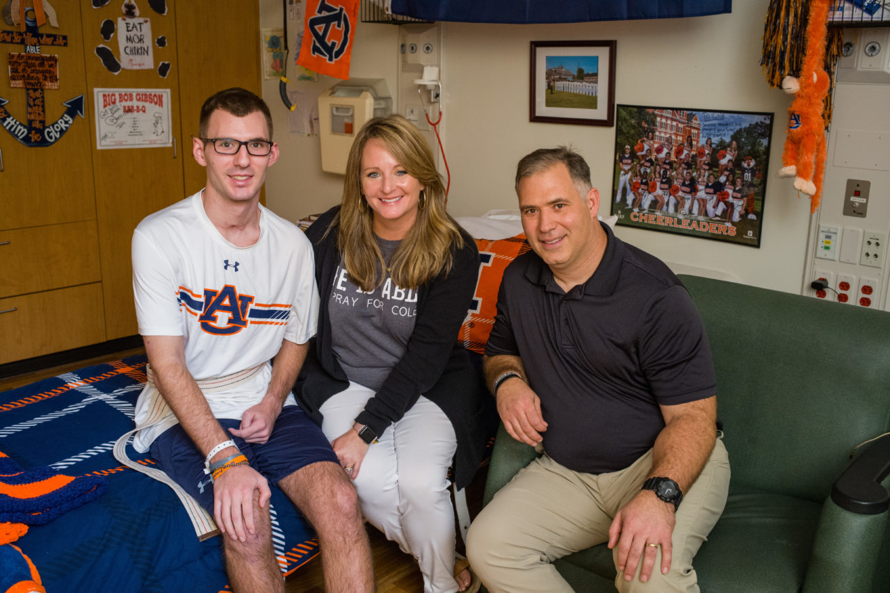 Shepherd graduate, Cole Burton with his parents, Charlie and Tina Burton, in his room at Shepherd Center.