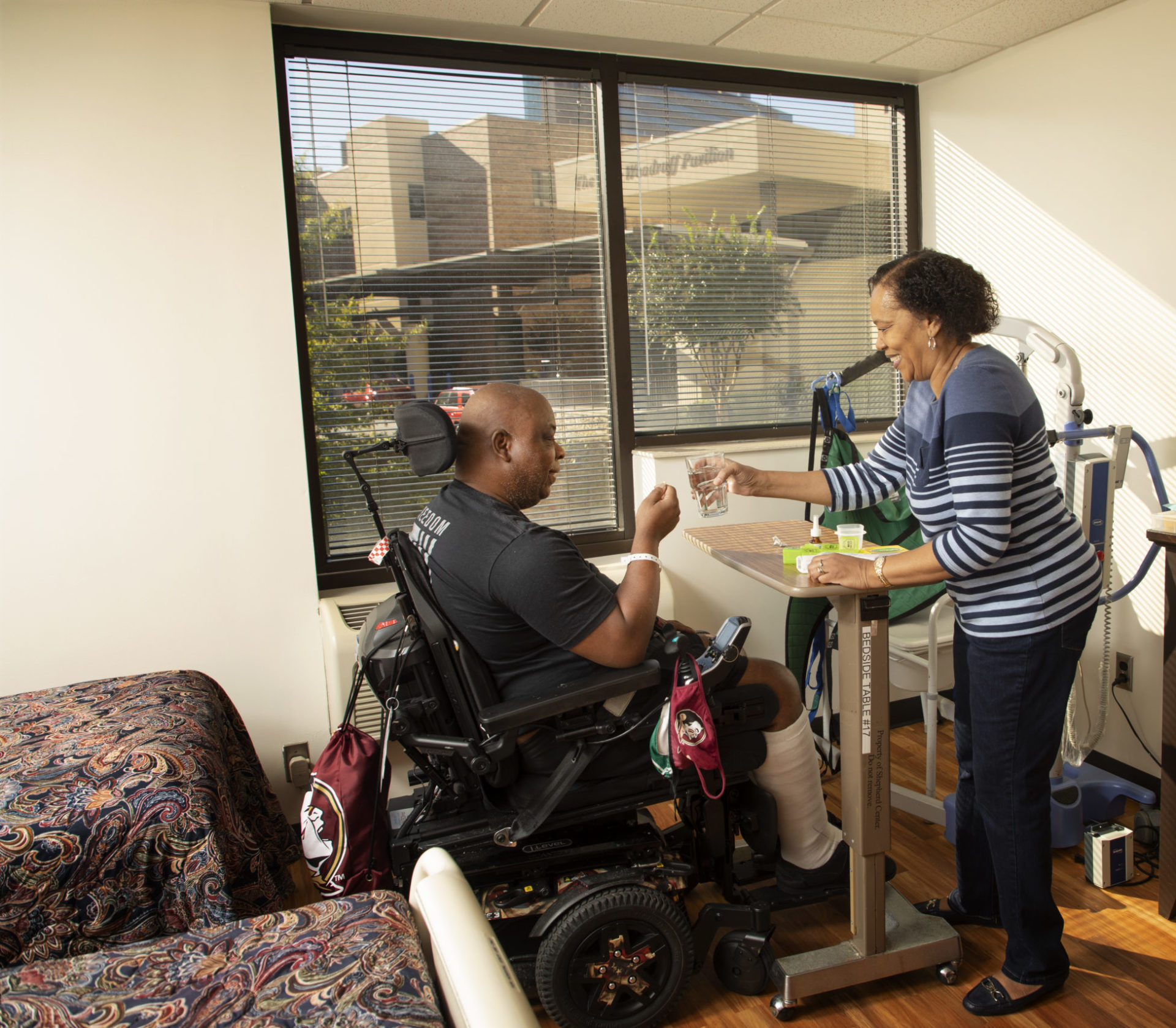 Family member assisting patient in the family housing center.