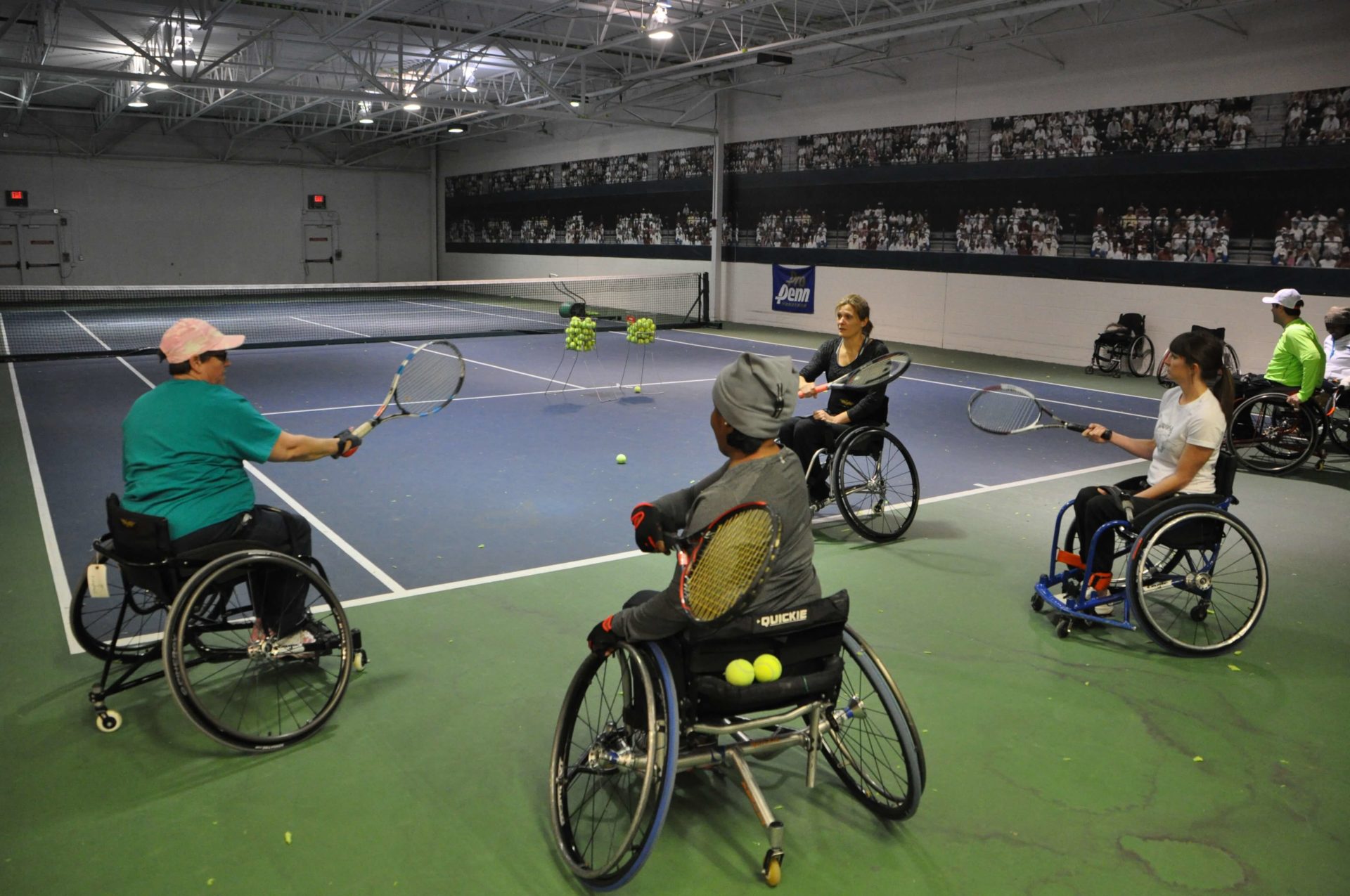 Shepherd patients playing tennis together.