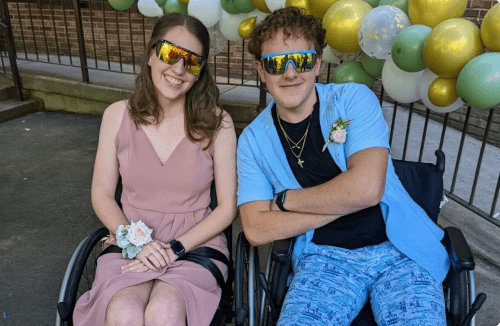 Two Shepherd patients dressed in formal wear, wearing polarized sunglasses at a Shepherd event.