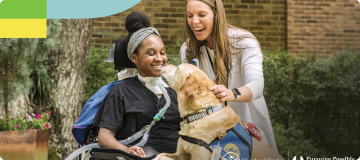 Shepherd patient and volunteer petting therapy dog.