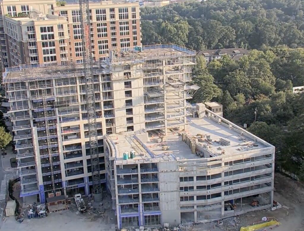 An aerial view of the progression of construction for the Arthur M. Blank Family Residences building.